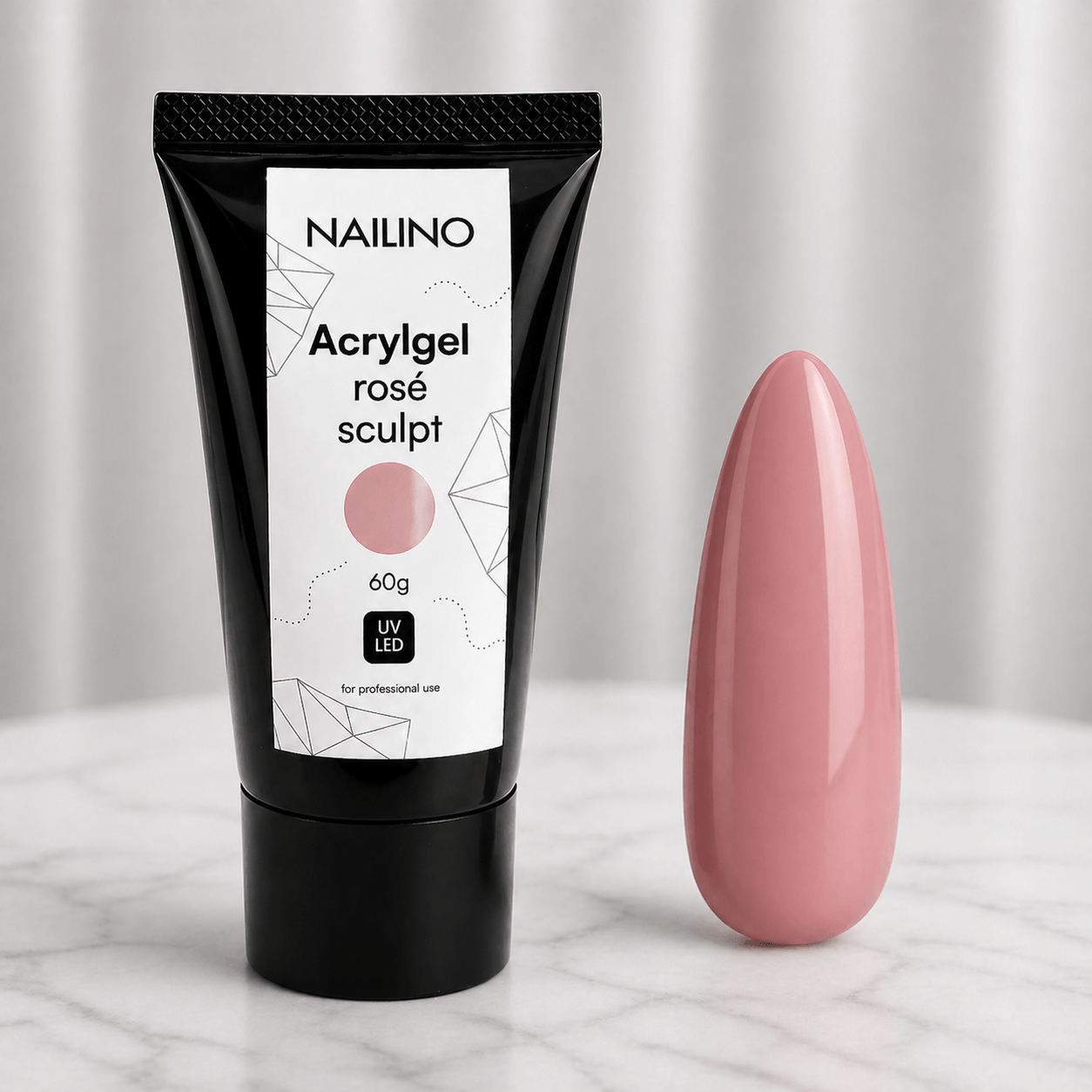NAILINO Acrylgel Rosé Sculpt – Tube und Nagelspitze in elegantem Rosé für professionelles Nageldesign.