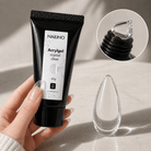 NAILINO Acrylgel Crystal Clear in schwarzer Tube mit transparentem Applikator und Tropfen, 60g für Nagelmodellage