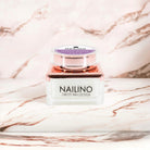 NAILINO Farbgel Mystic Mauve jar on marble background, showcasing Swiss nail design product with elegant mauve color.